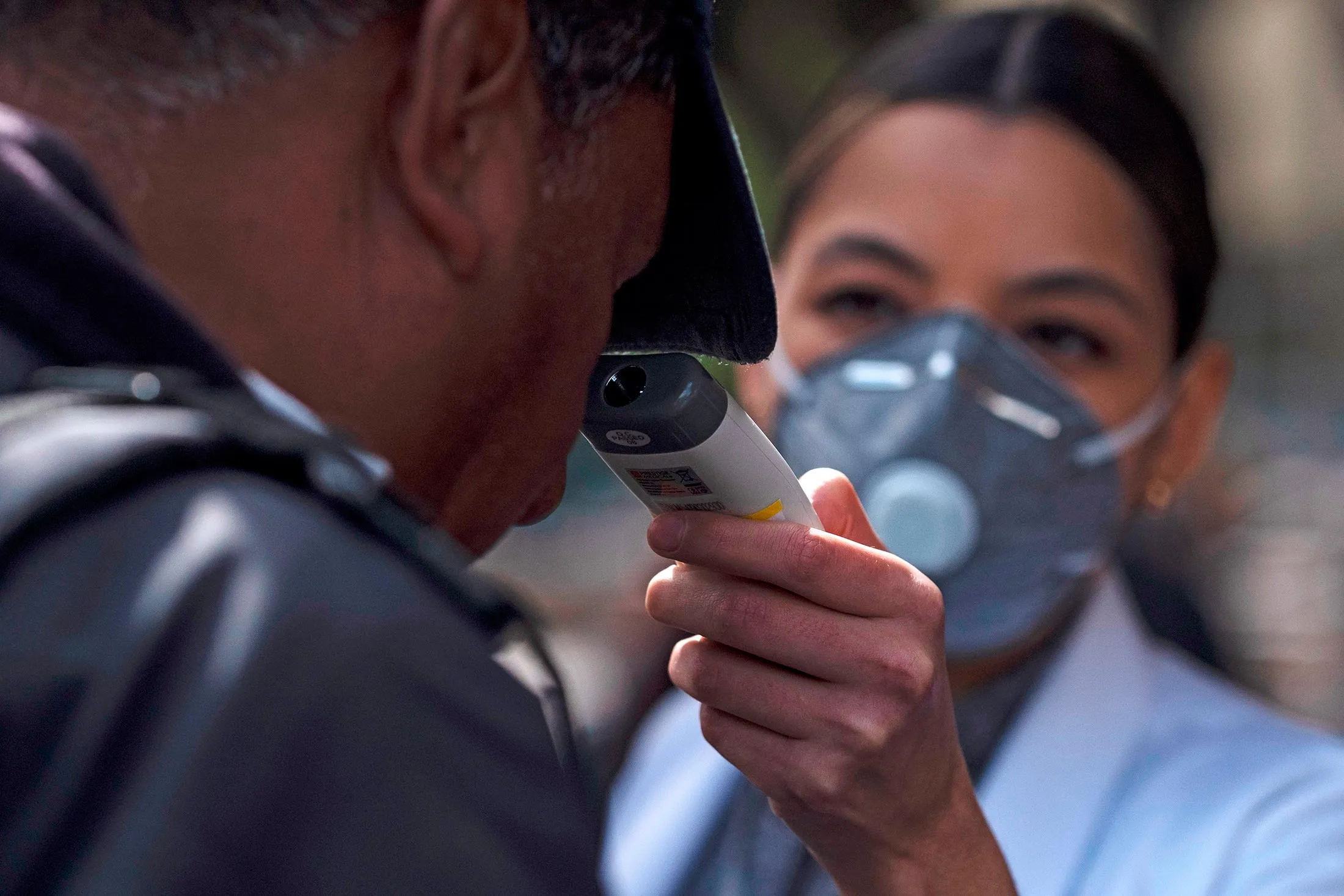 A nurse checks a man's temperature at the entrance of Tijuana's General Hospital, in Tijuana, Mexico, on March 2.&nbsp;