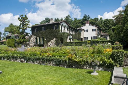 The house has acres of manicured gardens.