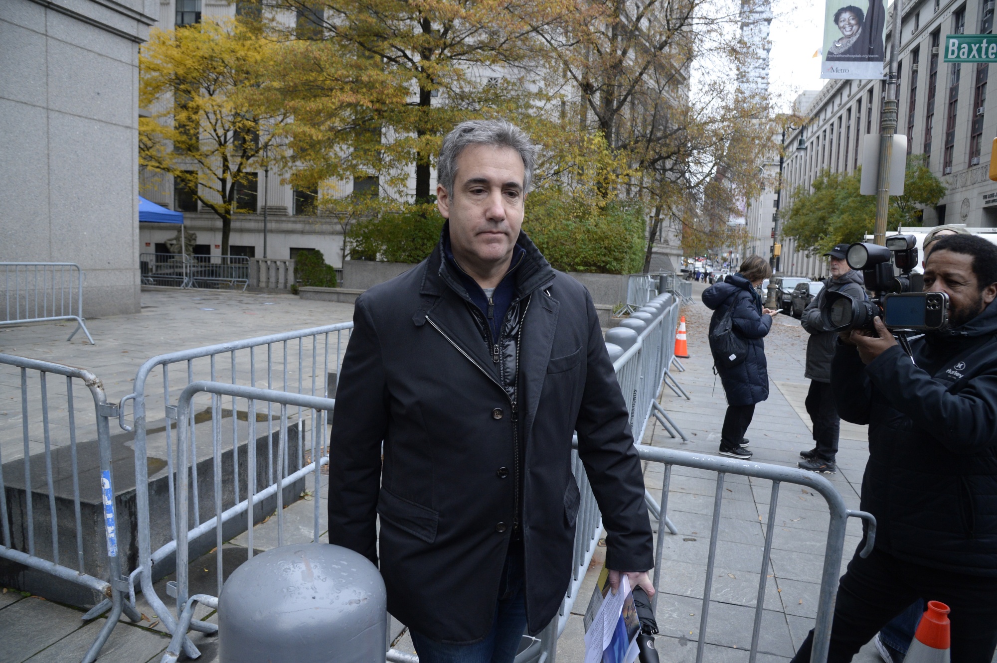 FILE - Michael Cohen leaves the District Attorney's office after