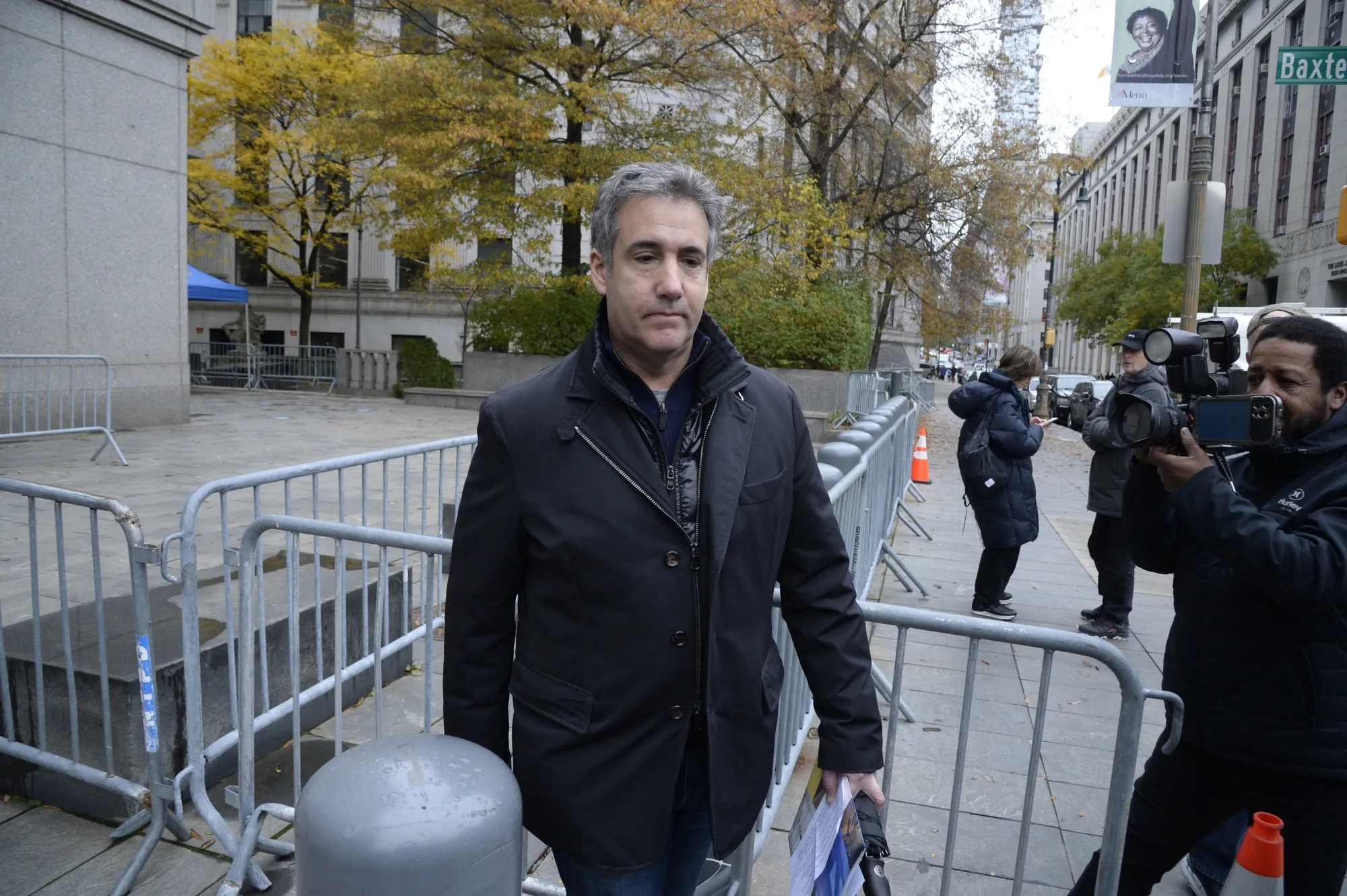 Michael Cohen leaves federal court in New York on Nov. 22, 2021.