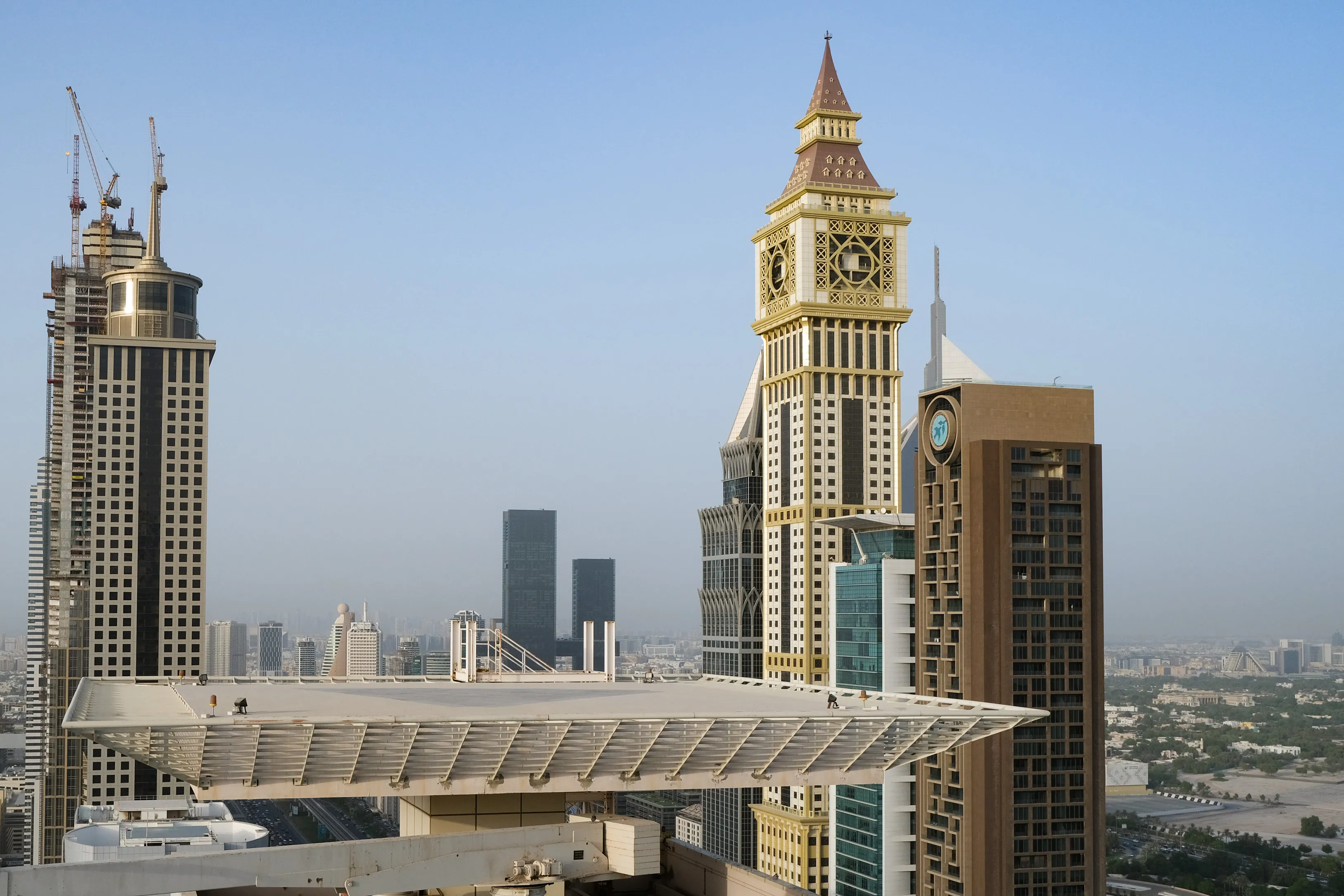 The building, now rebranded as AHS Tower, right, between skyscrapers in Dubai.
