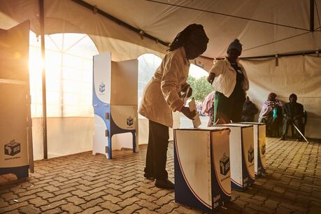 A voter places her ballot at a voting station in Nellmapius, east of Pretoria on May 29. 