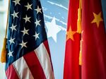 The Chinese and US national flags .