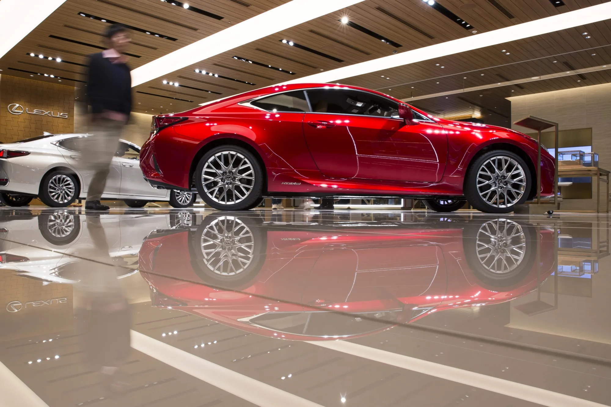Lexus RC300h coupe, left, and an ES300h sedan