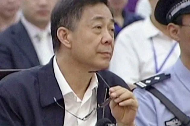 Bo Xilai looks up in a court room at Jinan Intermediate People's Court in Jinan, eastern China's Shandong province, on Aug. 26