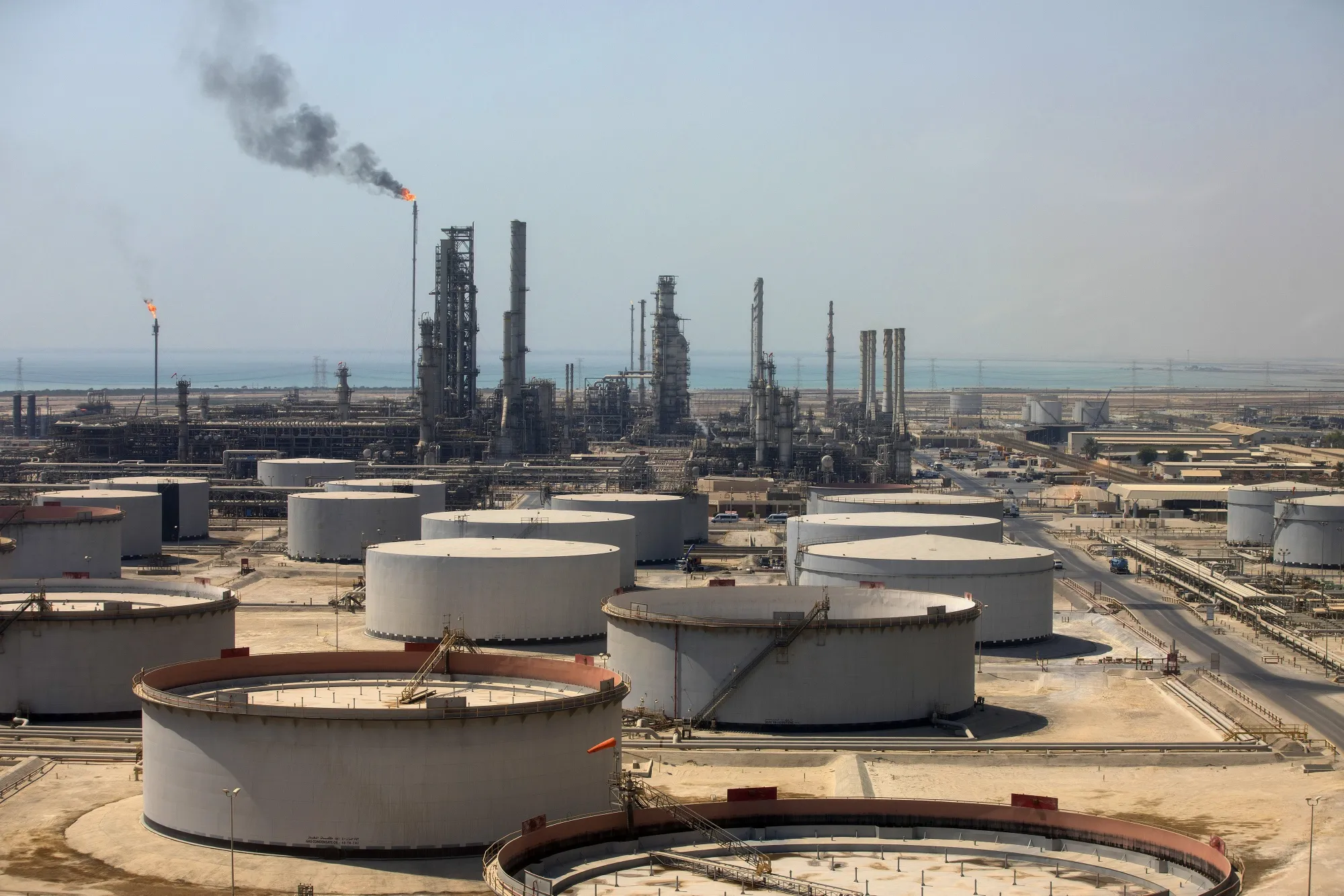Storage tanks and oil processing facilities at an oil refinery and terminal in Ras Tanura, Saudi Arabia.