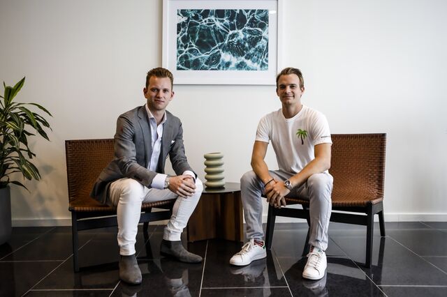 Kyle Sonlin, left, and Herwig Konings, co-founders of Security Token Market (STM), sitting for a photograph inside an office. 