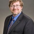 Headshot of Dr George J Brown