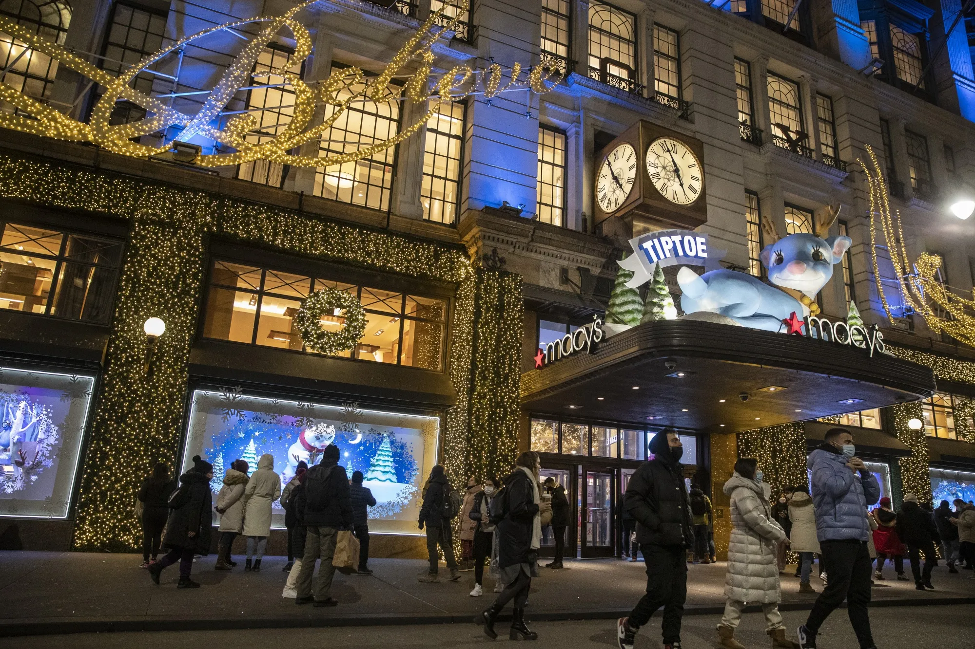 Shoppers walk past Macy's in New York.