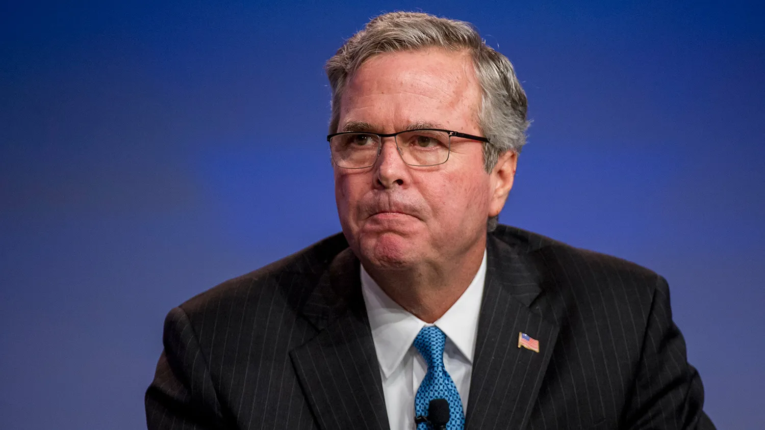 Jeb Bush, former governor of Florida, reacts during a keynote speech session at the National Automobile Dealer Association (NADA) conference in San Francisco, California, U.S., on Friday, Jan. 23, 2015.
