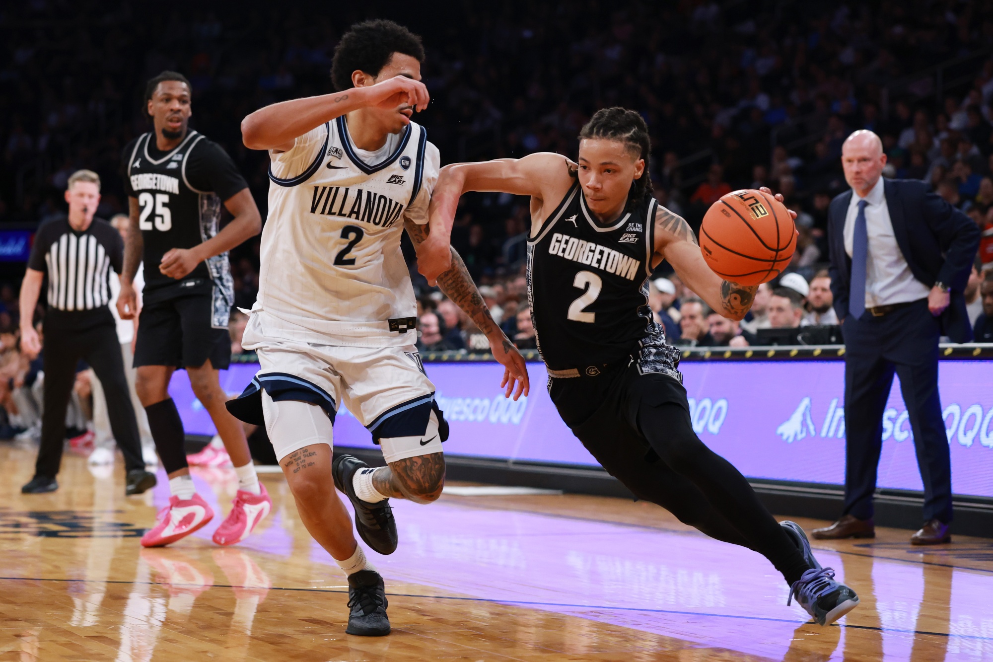 Mack drives with the ball for the Georgetown Hoyas in a game against the Villanova Wildcats in the 2026 Big East tournament. Photographer: Sarah Stier/Getty Images