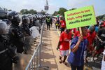 Protesters march towards the Presidential Palace during a demonstration over soaring living costs in Accra, Ghana, on June 29.