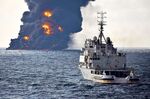 A rescue ship sails near the burning Iranian oil tanker Sanchi in the East China Sea on Jan. 14.