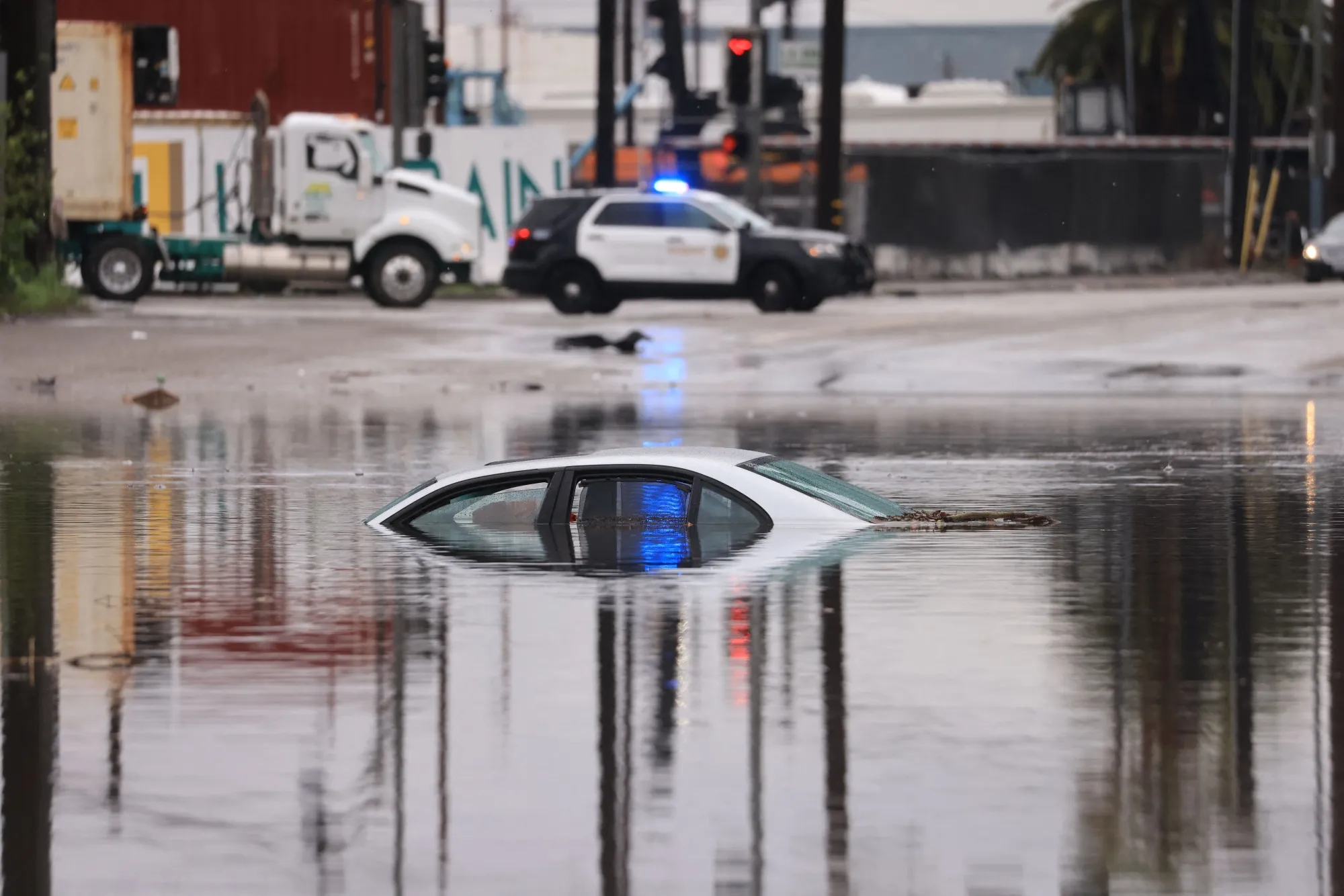 A partially submerged car on a flooded road during a storm in Long Beach, California, on Feb. 1.