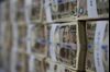 Japanese 10000 yen banknotes are stacked for a photograph at the Korea Exchange Bank headquarters in Seoul, South Korea, on Thursday, Feb. 13, 2014. The yen rose versus the dollar for a third-straight day, the longest stretch in more than three weeks, before U.S. data today that may show industrial production gains moderated, while consumer sentiment declined.
