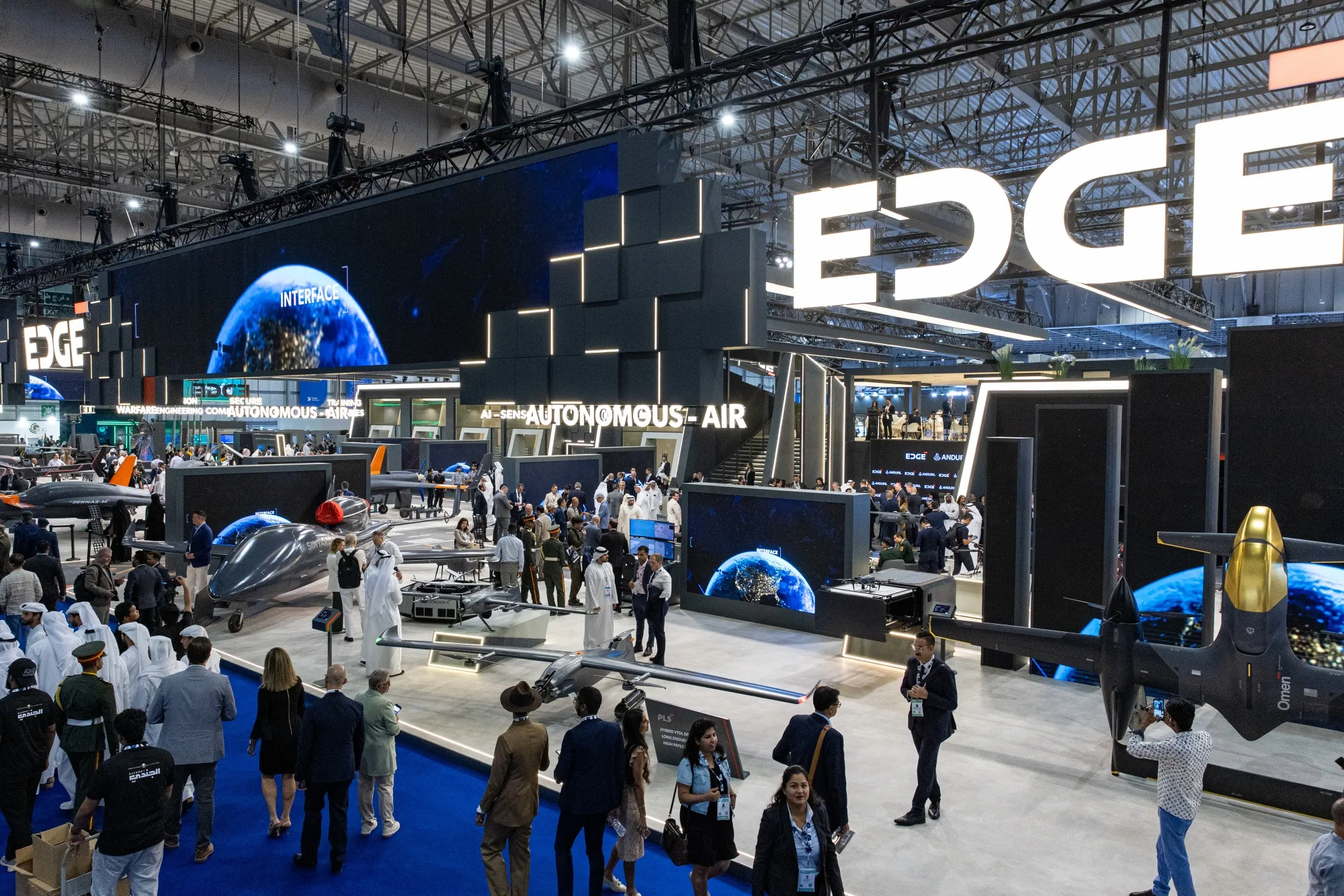 An Omen hybrid-electric vertical takeoff and landing&nbsp;drone, developed by Anduril and Edge Group, right, at the Dubai Air Show.