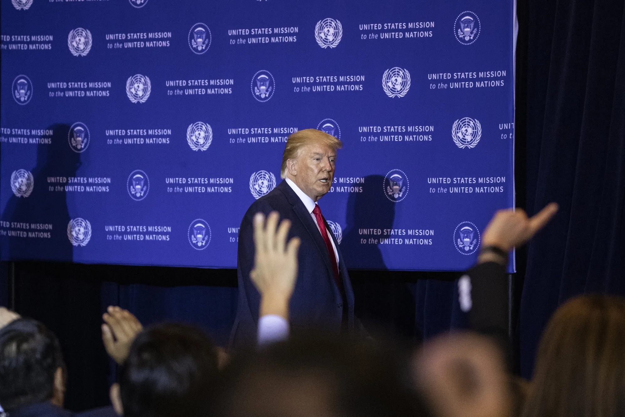 Donald Trump leaves following a news conference in New York on Sept. 25.