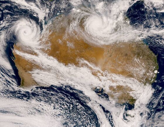 Twin Cyclones Batter Australia, Halting Mining Operations