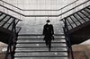 A man wear mask to prevent the coronavirus (COVID-19) walk along the street on February 23, 2020 in Seoul.