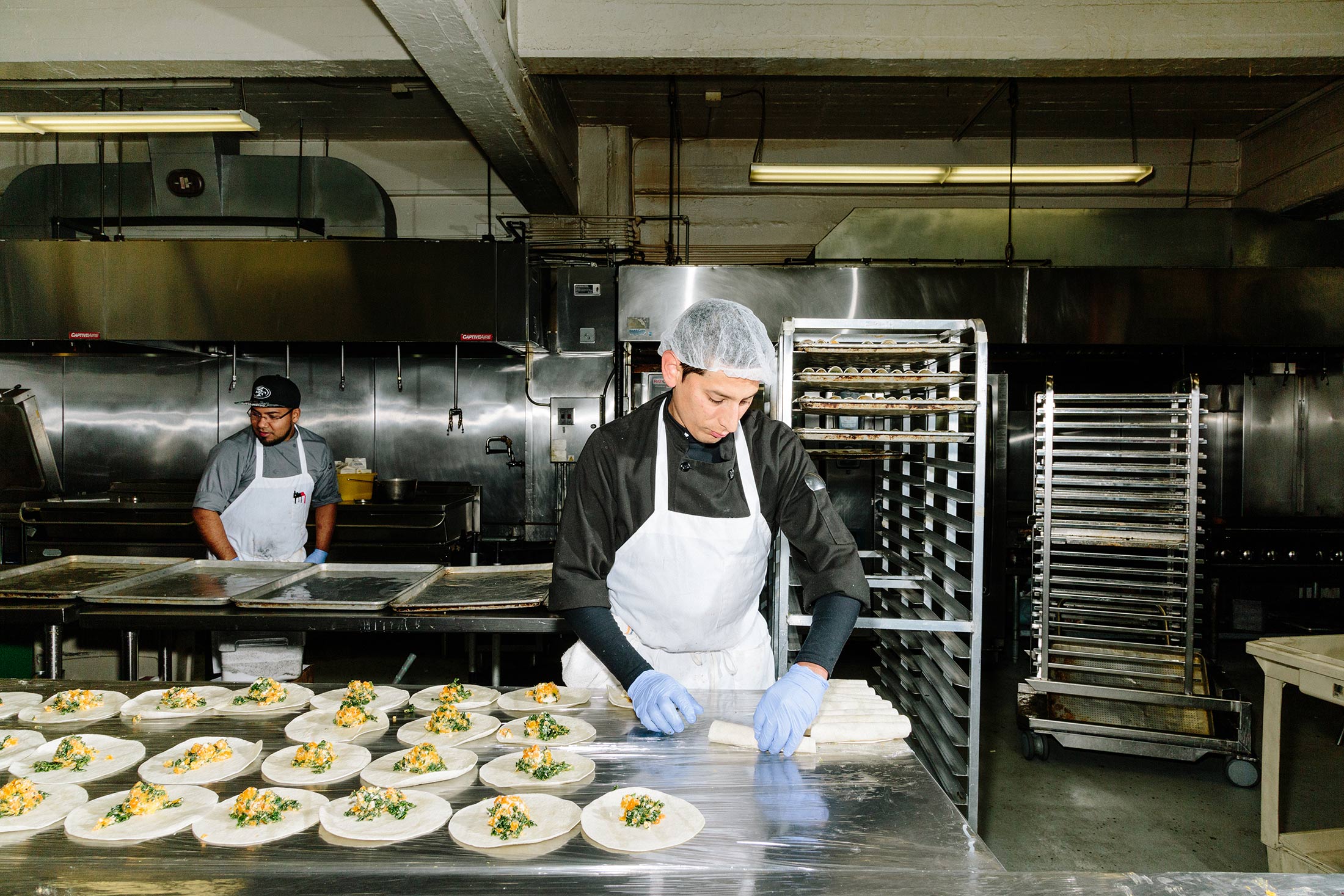 A worker prepares meals at the San Francisco kitchen.
