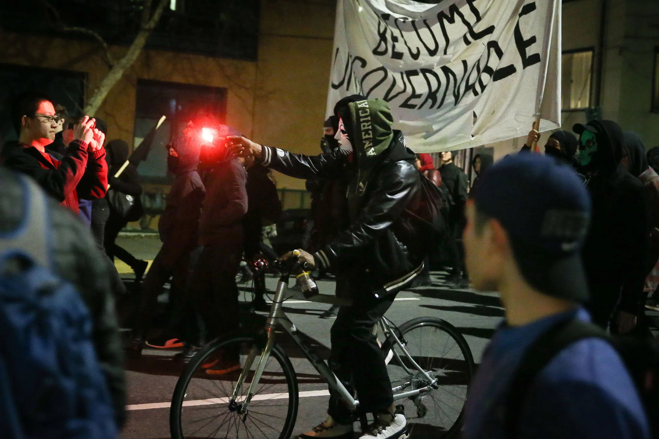 People protesting Milo Yiannopoulos march in the street on Feb. 1, 2017, in Berkeley, California.
