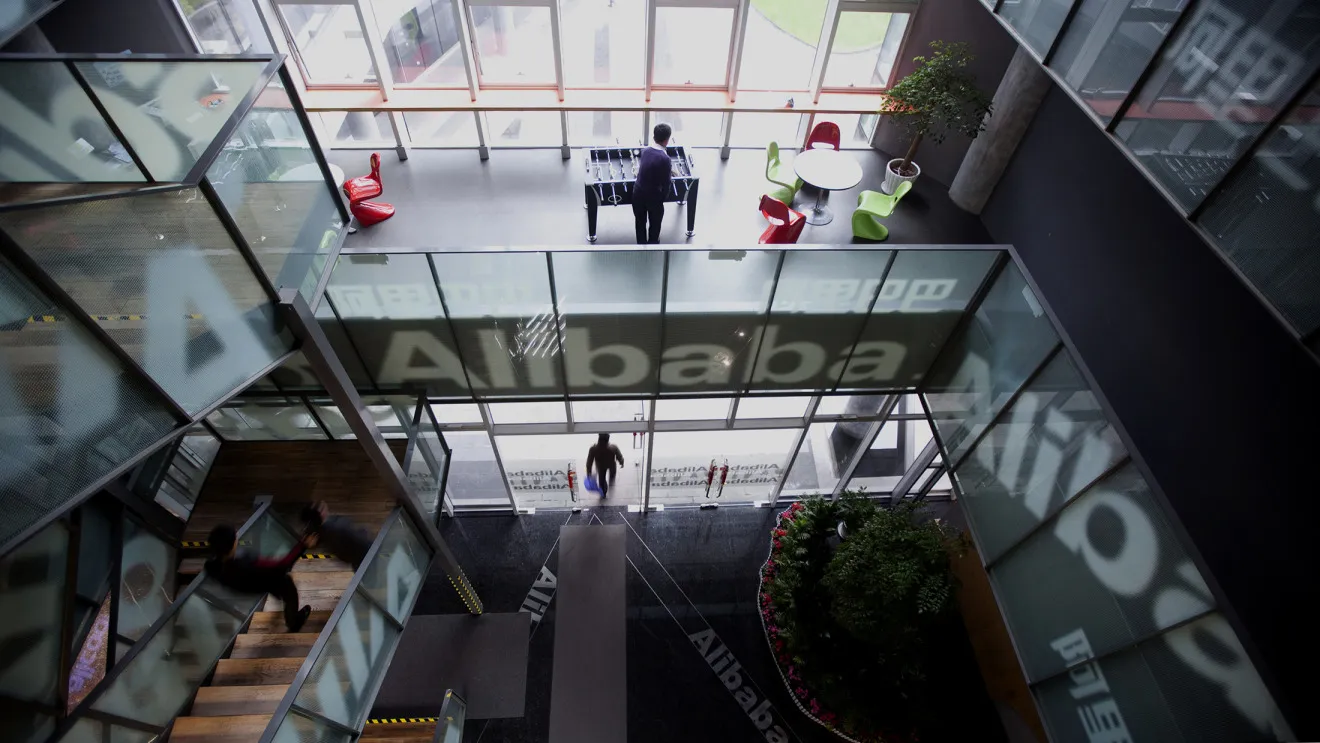People walk through Alibaba headquarters in Hangzhou.
