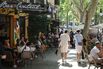 Customers sit in outdoor restaurants in Palma de Mallorca, Spain.