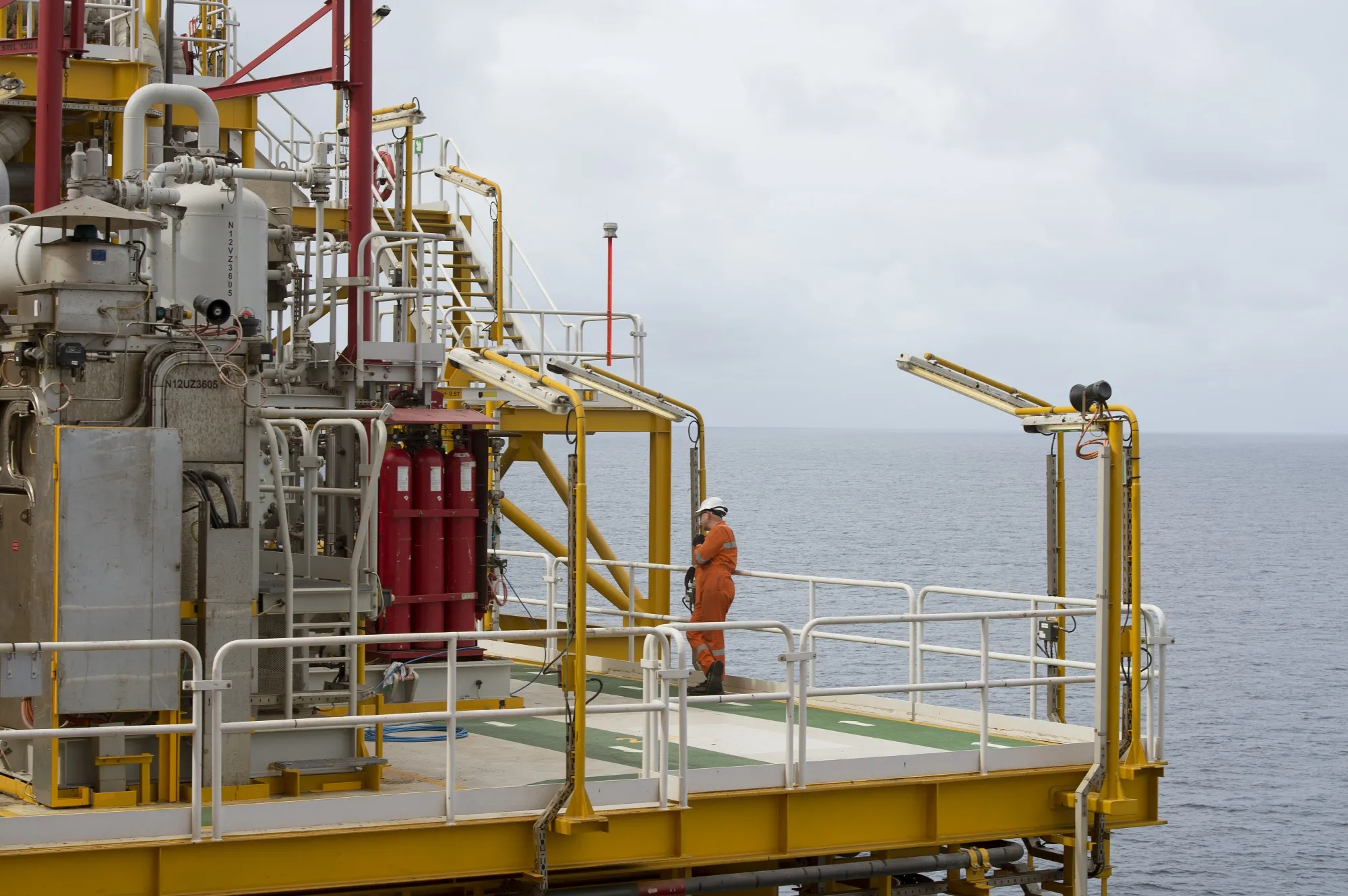 A worker walks on&nbsp;a Floating Production Storage and Offloading vessel off the coast of Angola in the Atlantic Ocean.