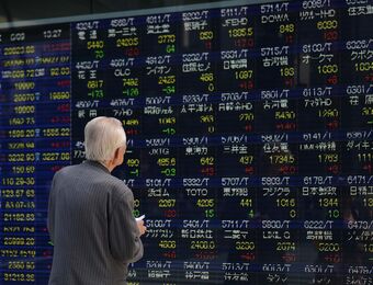 relates to Japan Stocks Swing as Banks Drag on Topix, Electronics Advance