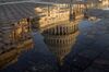 The U.S. Capitol building is reflected in a puddle at sunrise in Washington, D.C., U.S., on Wednesday, July 19, 2017. The Senate early next week will consider the motion to proceed to legislation to repeal Obamacare without finding a replacement for two years after a setback for Republicans' efforts this week to repeal and replace the bill. Senate Majority Leader McConnell said he's scheduling the vote at the request of President Trump and Vice President Pence.