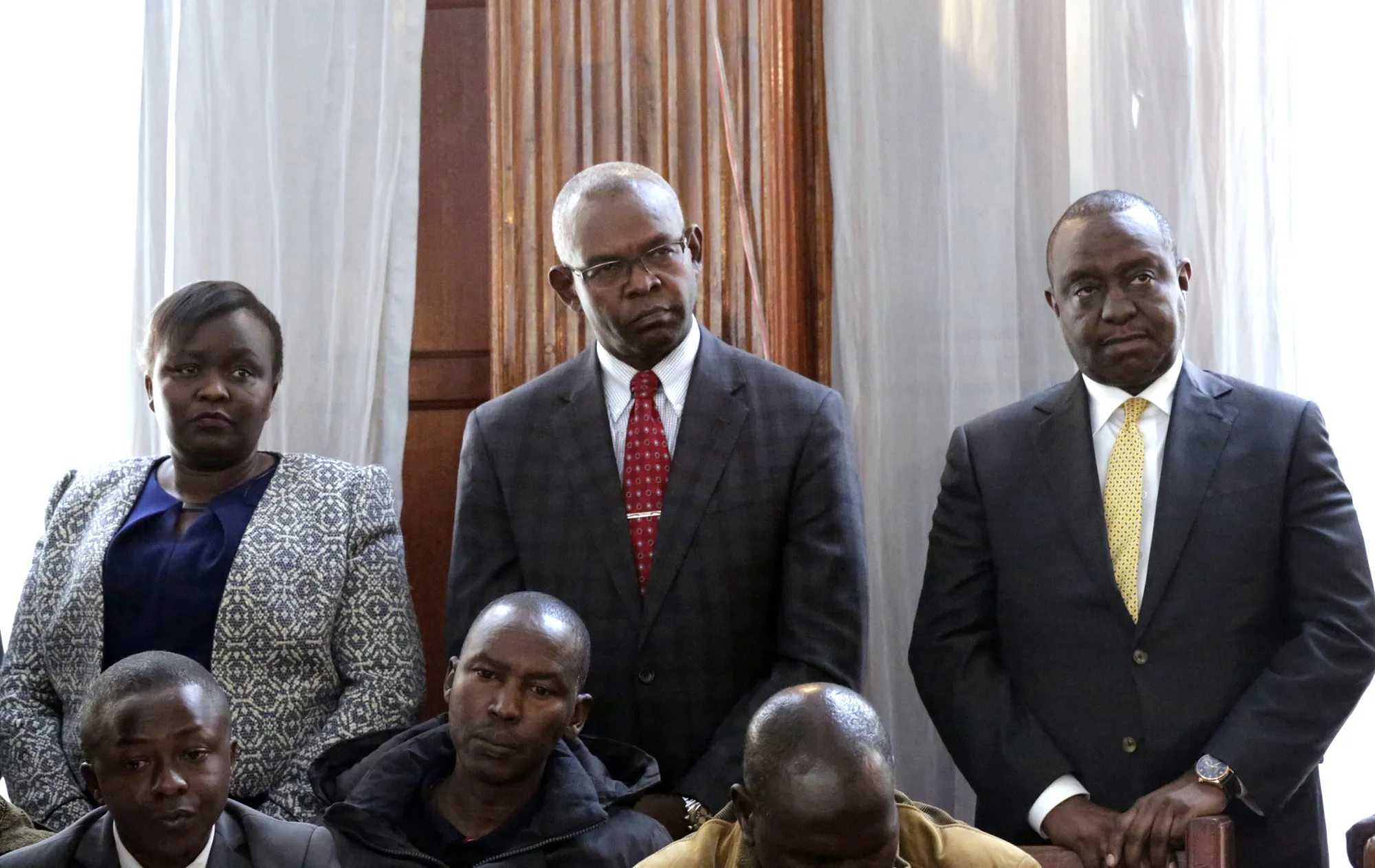Kamau Thugge stands in the center.&nbsp;