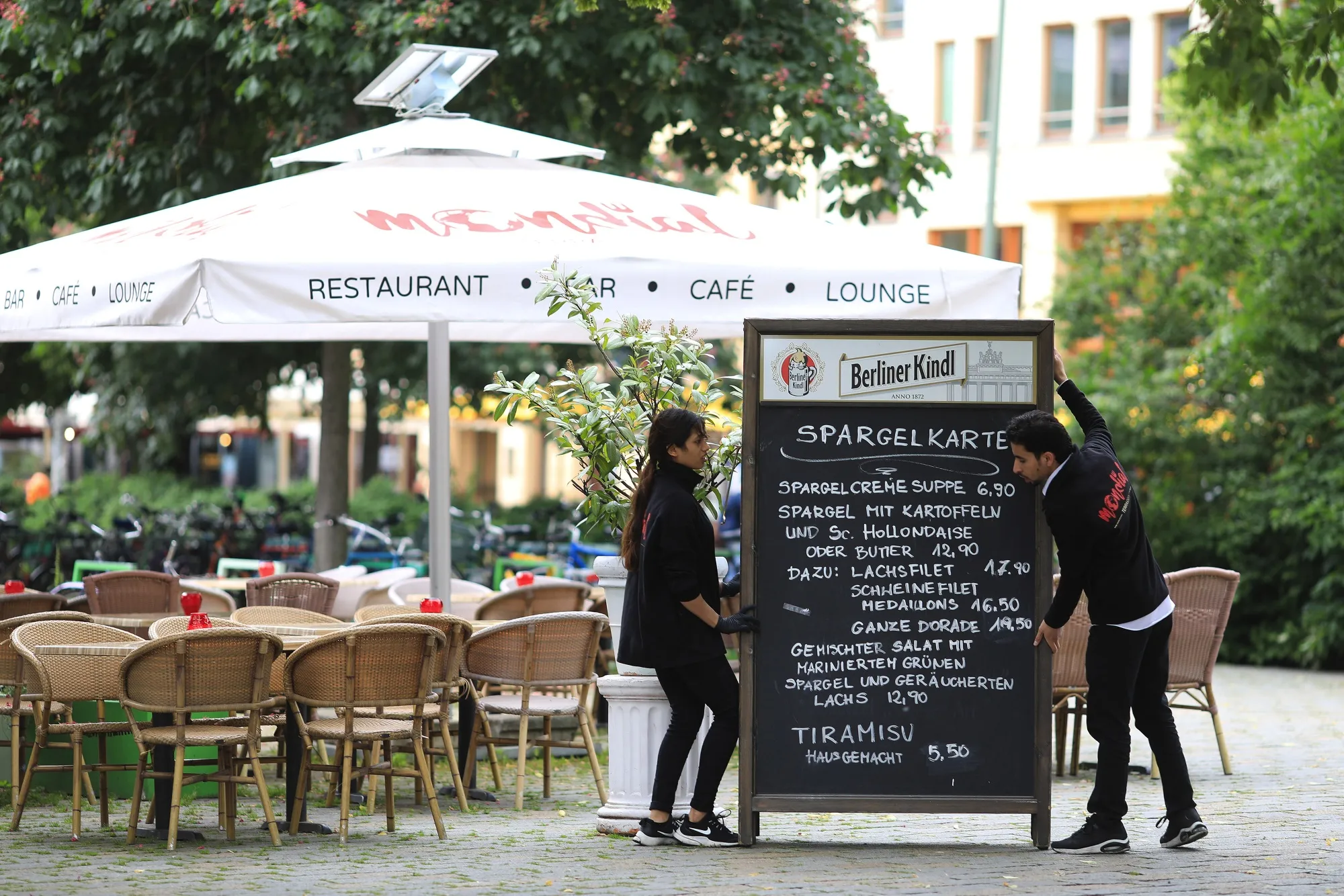 Workers prepare a restaurant terrace in Berlin on June 4.