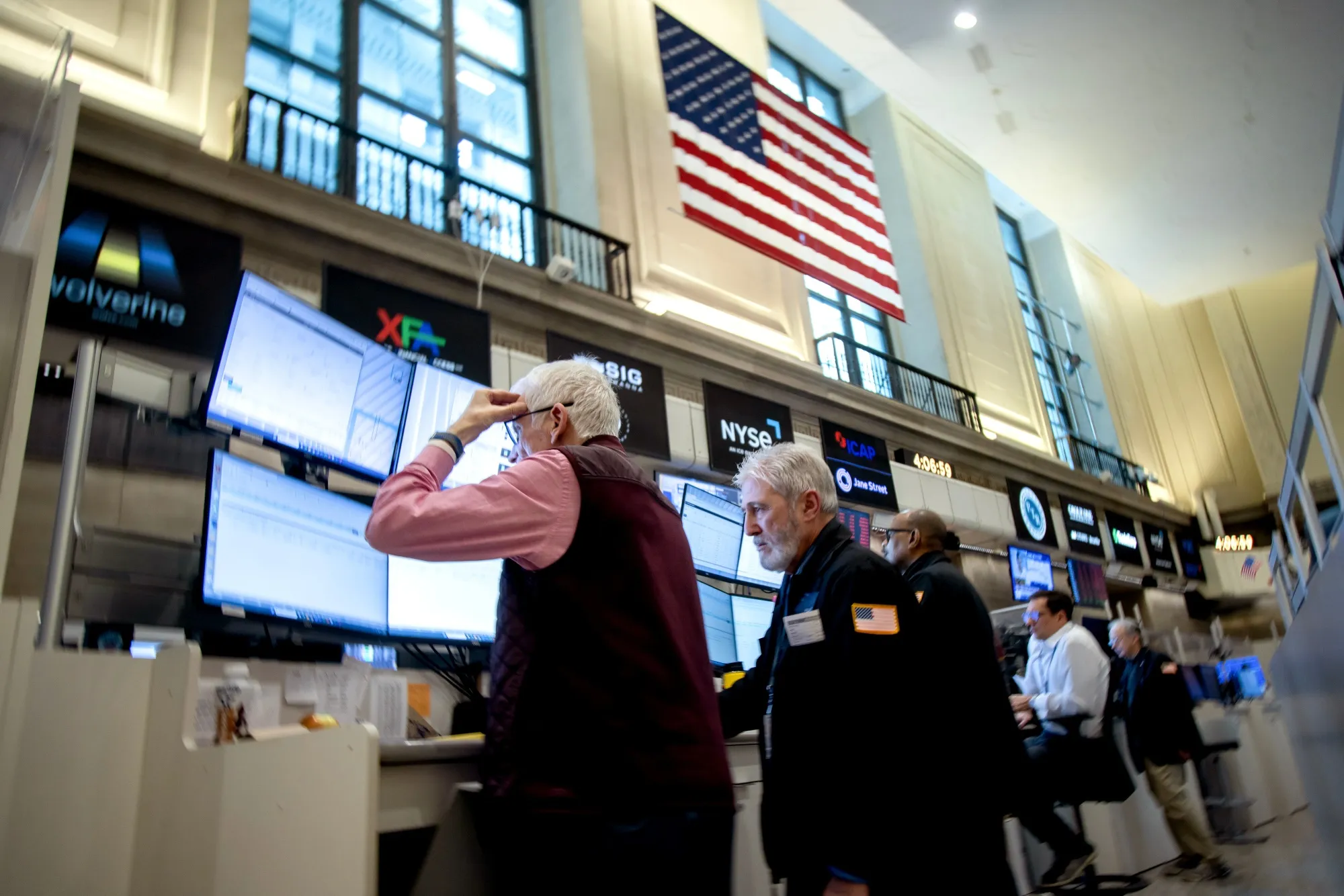 Traders work on the floor of the New York Stock Exchange, April 4.
