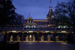 Employees stand at an exit of the Disneyland theme park in Anaheim, California on March 13.