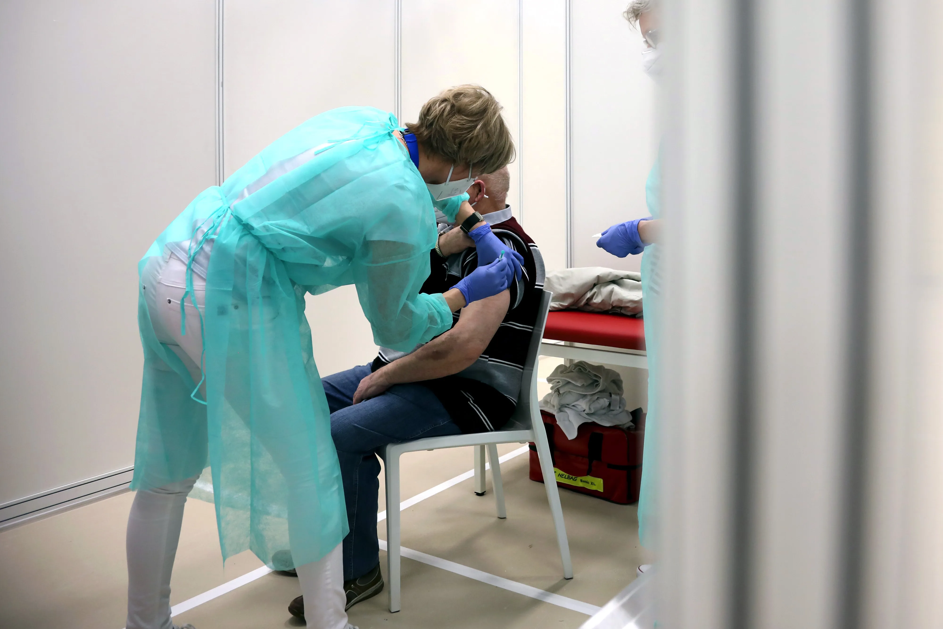 A visitor receives a dose of the Moderna Inc. Covid-19 vaccine in Luckenwalde, Germany.