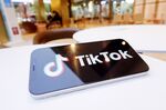 In this photo illustration, a Tiktok logo is displayed on