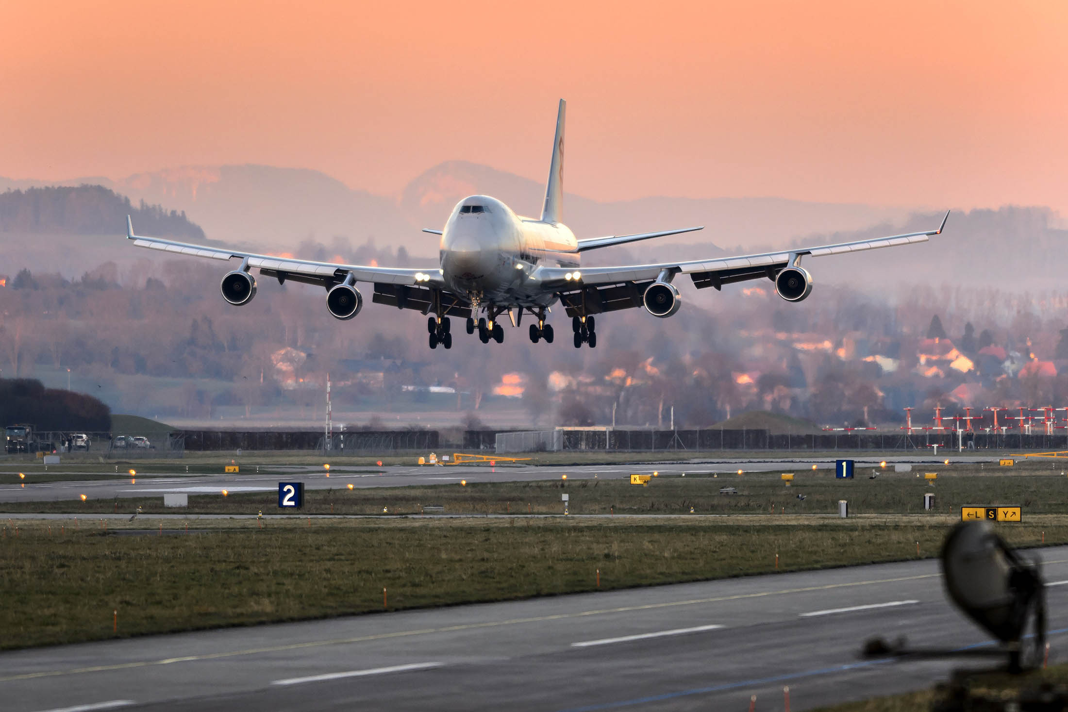 A Cargolux Boeing 747 cargo aircraft lands on January 5, 2015 at Payerne airport. The Boeing will carry solar-powered Solar Impulse 2 aircraft to Abu Dhabi where the attempt to fly around the world in stages using only solar energy will start on March 2015. AFP PHOTO / FABRICE COFFRINI (Photo credit should read FABRICE COFFRINI/AFP/Getty Images)
