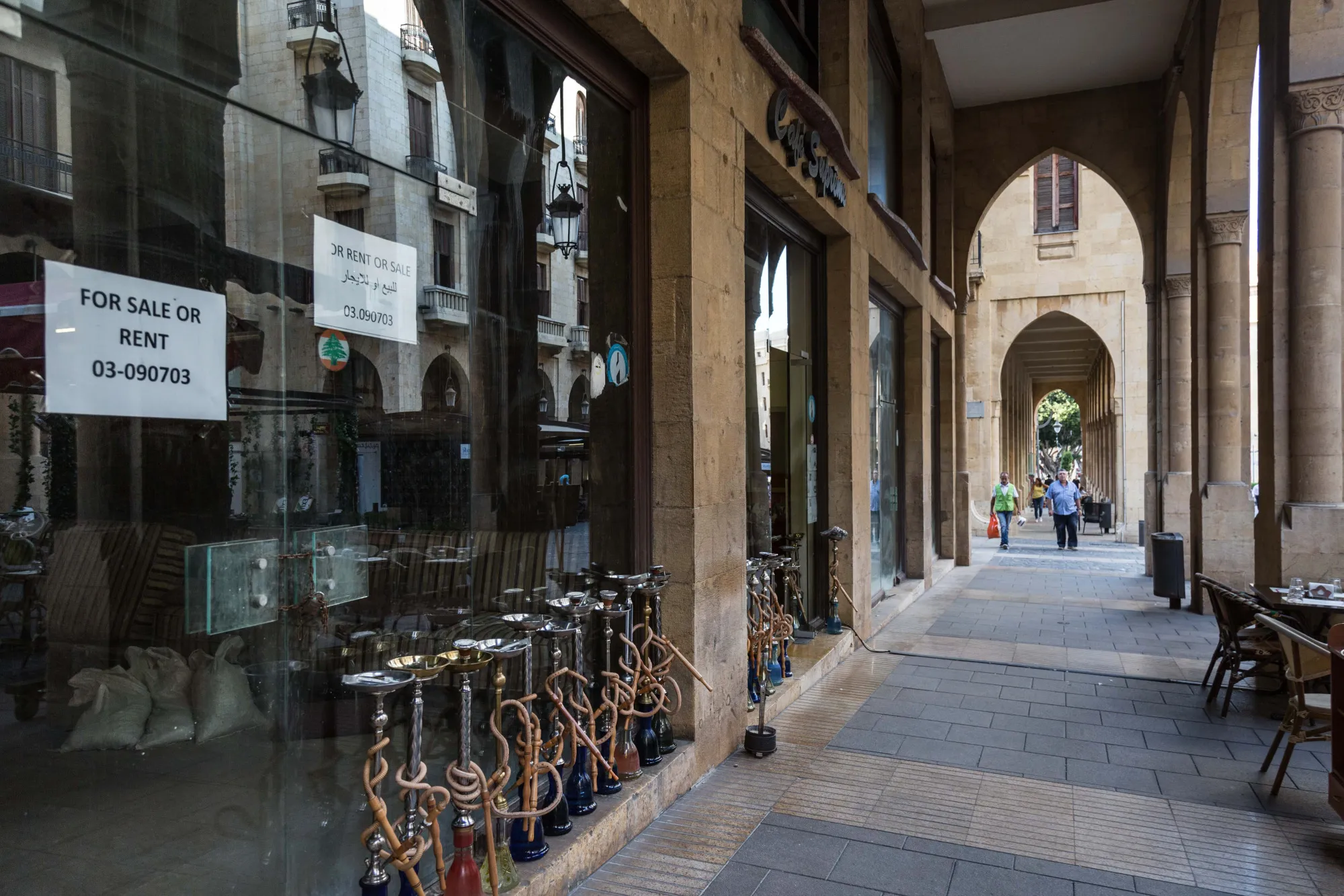 Hookah pipes stand outside an empty store for rent at the Solidere shopping district in Beirut, Lebanon.