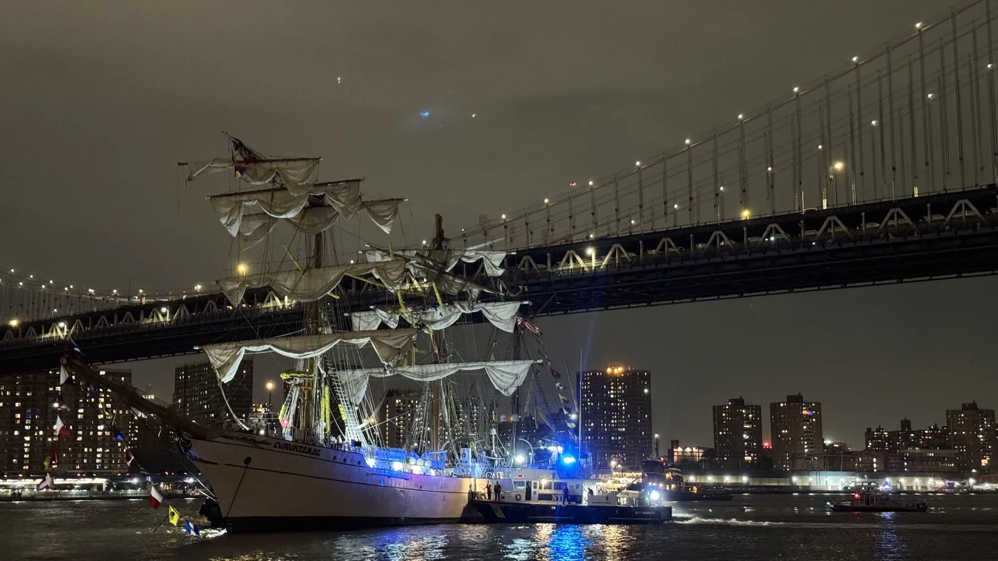 New York City Fire and Police department boat respond to a Mexican Navy vessel that crashed into the Brooklyn Bridge on May 17.