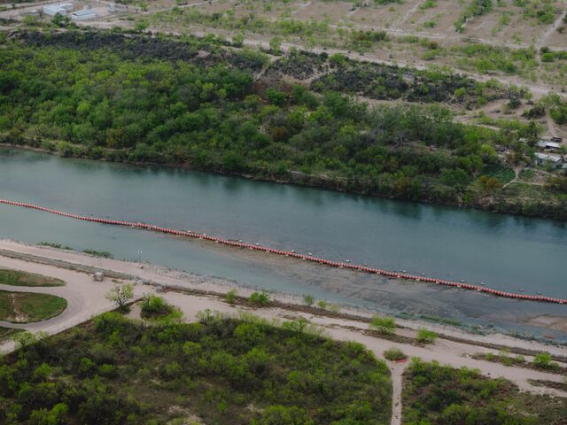 Floating barriers in the Rio Grande to deter migrants from crossing into the state from Mexico. 