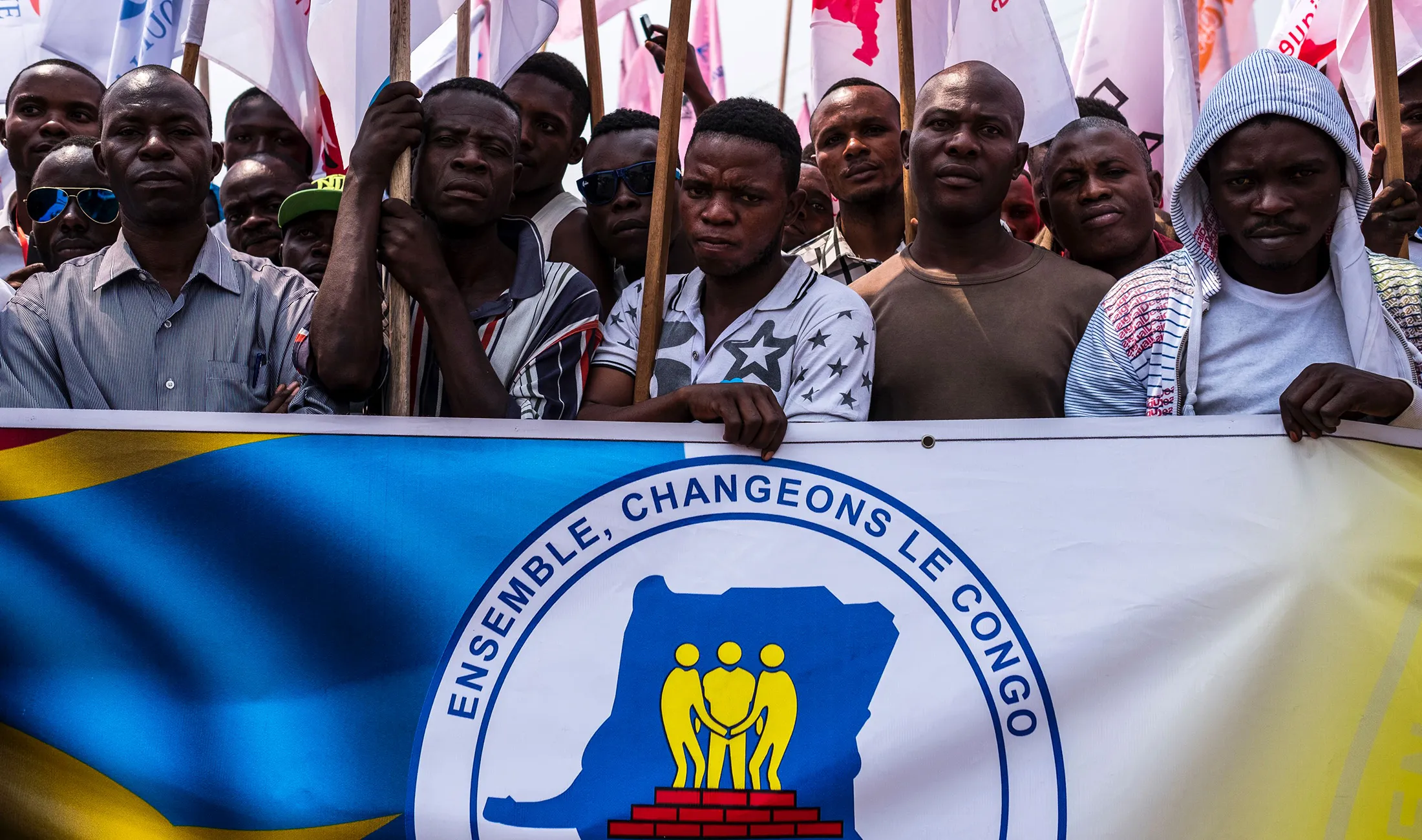 Opposition supporters pose during a rally organised by political opposition parties in Kinshasa, on July 31, 2016.
