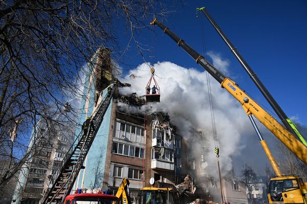 Emergency services work at the site of a residential building following a Russian attack, in Ternopil, Ukraine, in November.