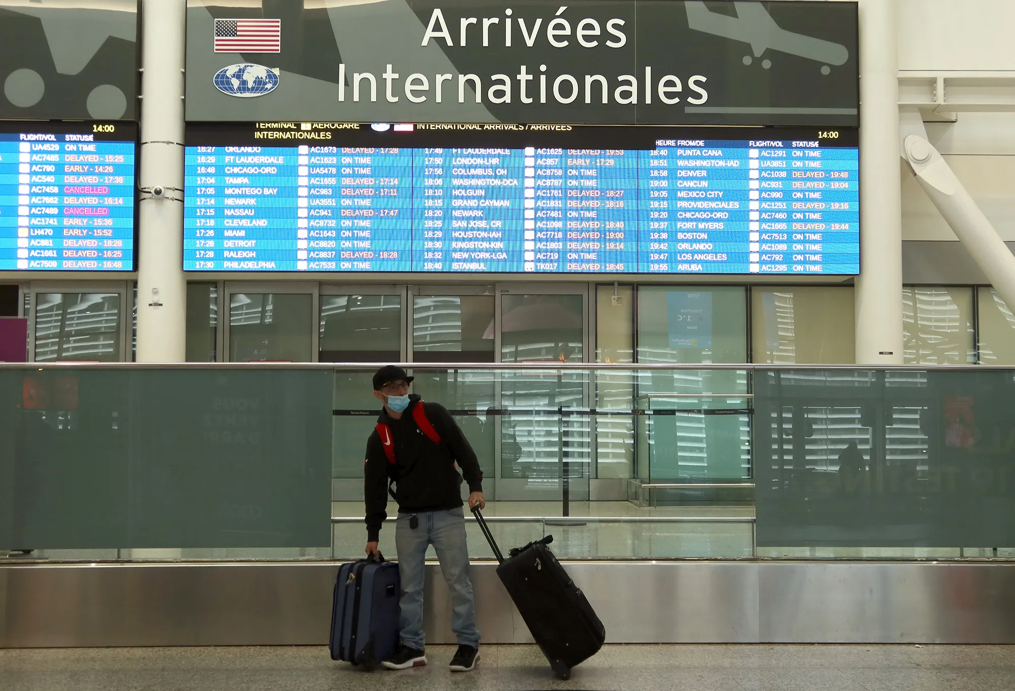A traveler at Pearson International Airport in Toronto, on Dec. 27.