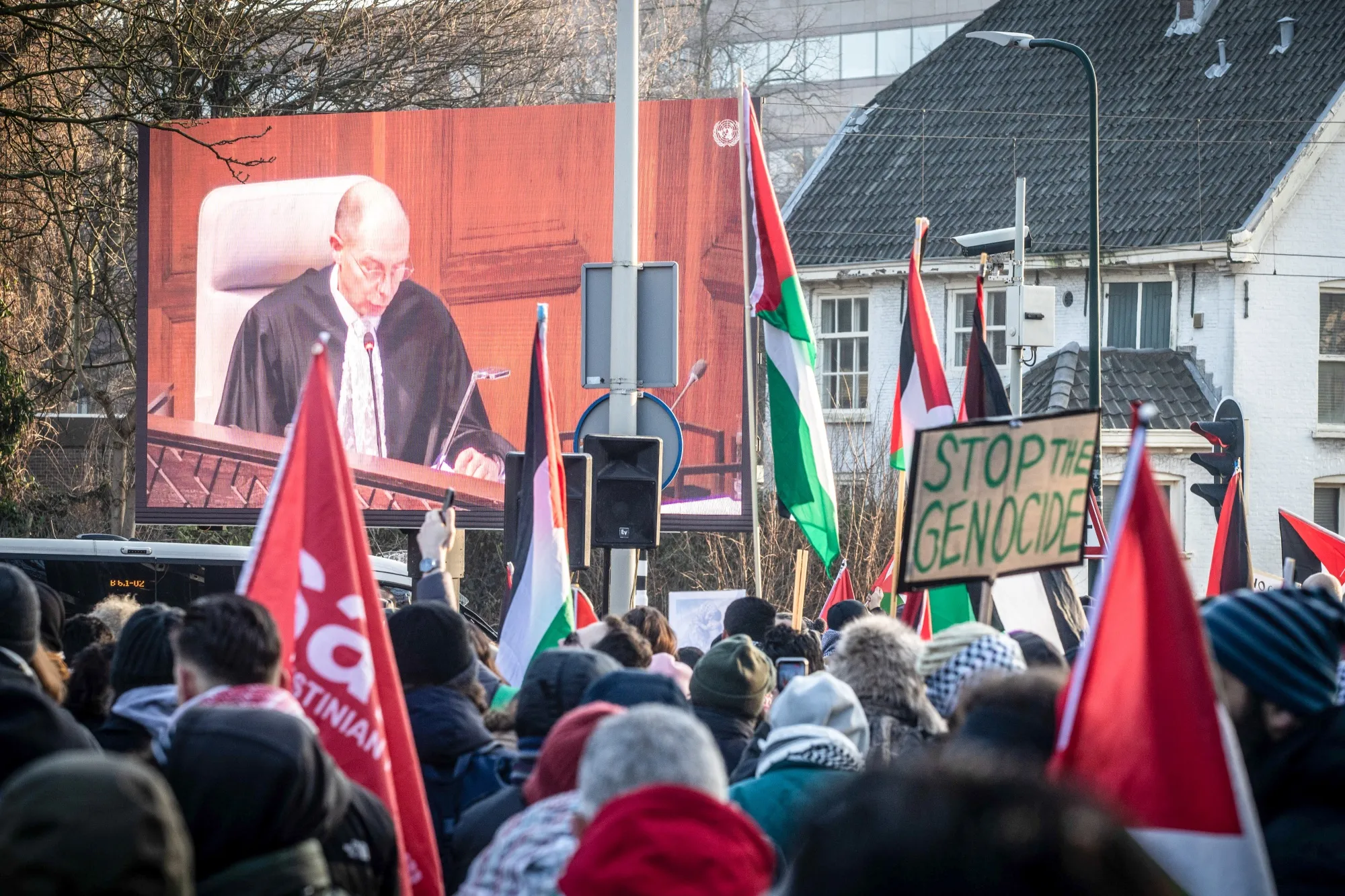 Pro-Palestinian demonstrators watch proceedings at the International Court of Justice in The Hague, Netherlands, on Jan. 11.
