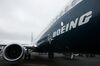 The Boeing Co. logo sits on the side of a 737 Max aircraft during preparations ahead of the Farnborough International Airshow 2016 in Farnborough, U.K., on Sunday, July 10, 2016. The air show, a biannual showcase for the aviation industry, runs until July 17.