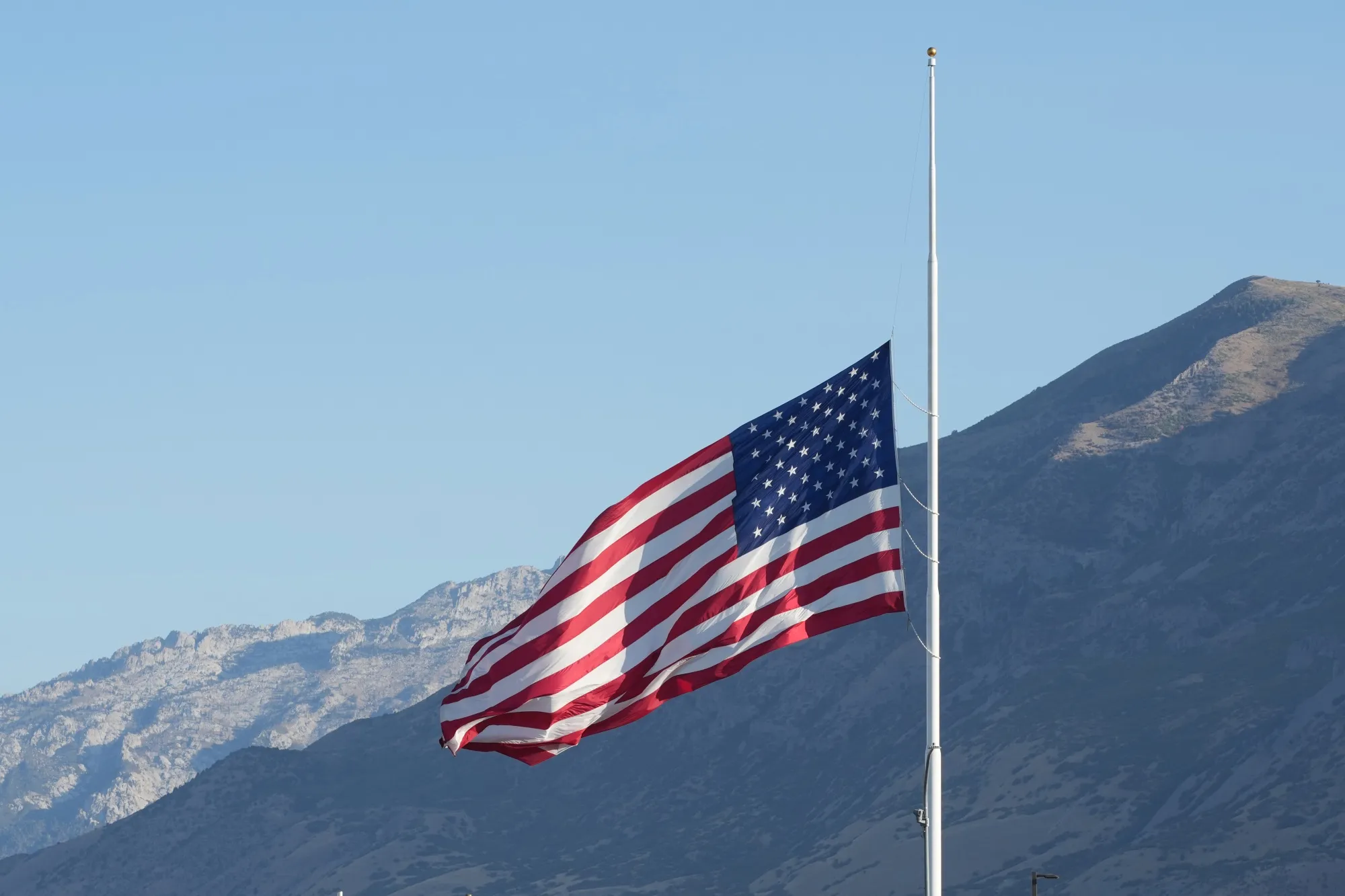 A flag flies at half-mast in honor of conservative activist Charlie Kirk in Orem, Utah, on Sept. 11.