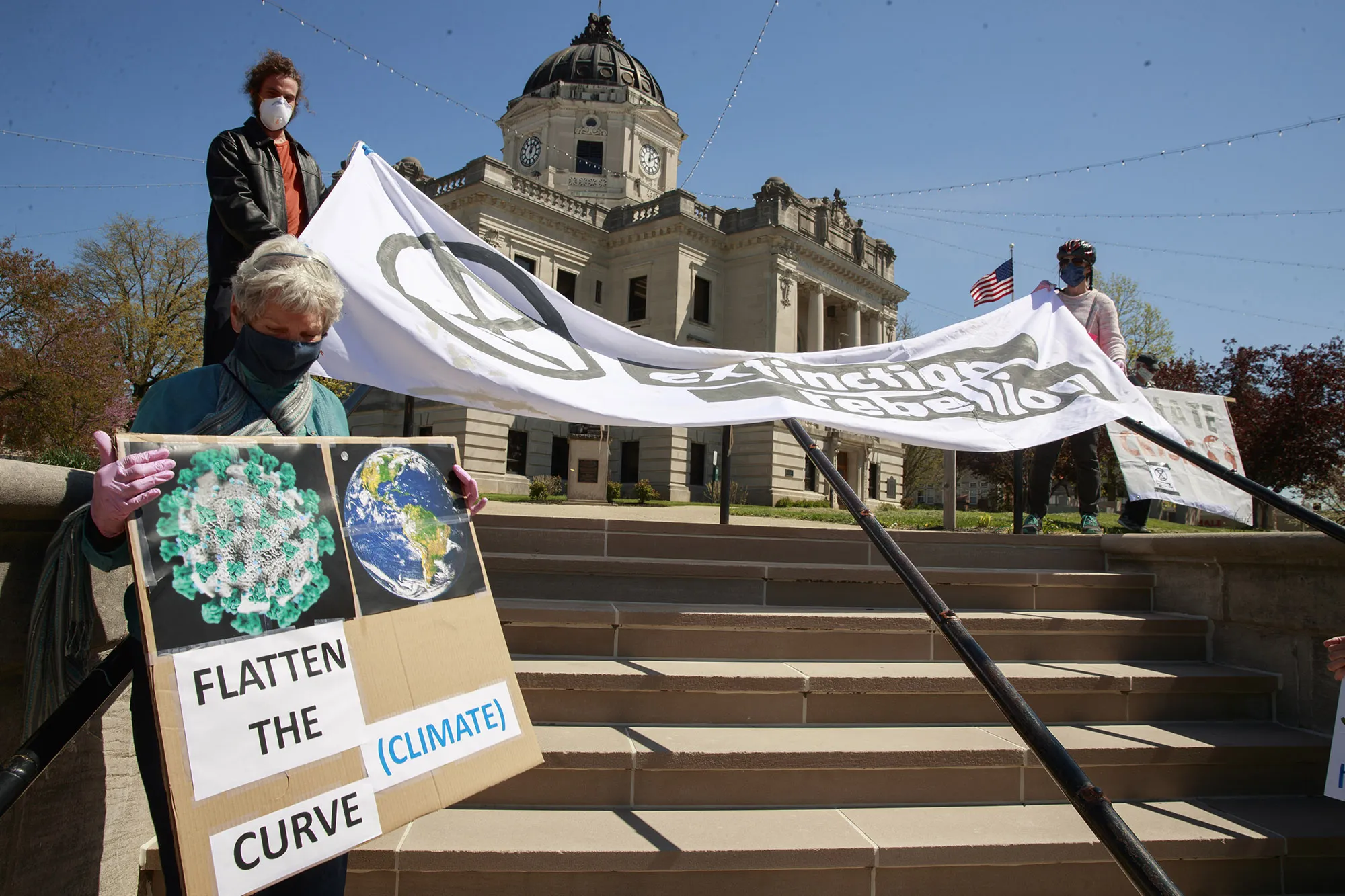 Members of Extinction Rebellion participate in a socially-distant Earth Day demonstration in Bloomington, U.S.