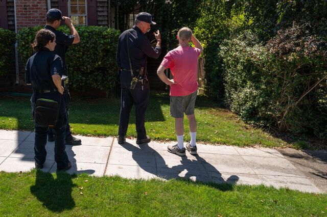 Berkeley Fire Department Wildland Urban Interface inspectors speak with a resident while conducting wildfire defensible space and home hardening evaluations.