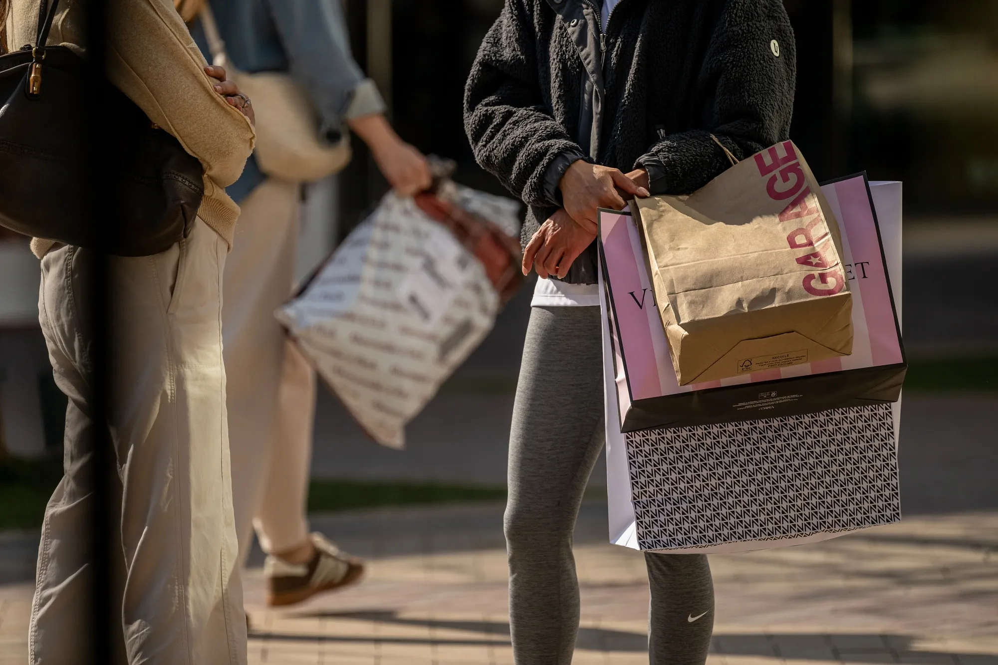 A shopper carries bags&nbsp;in Walnut Creek, California.
