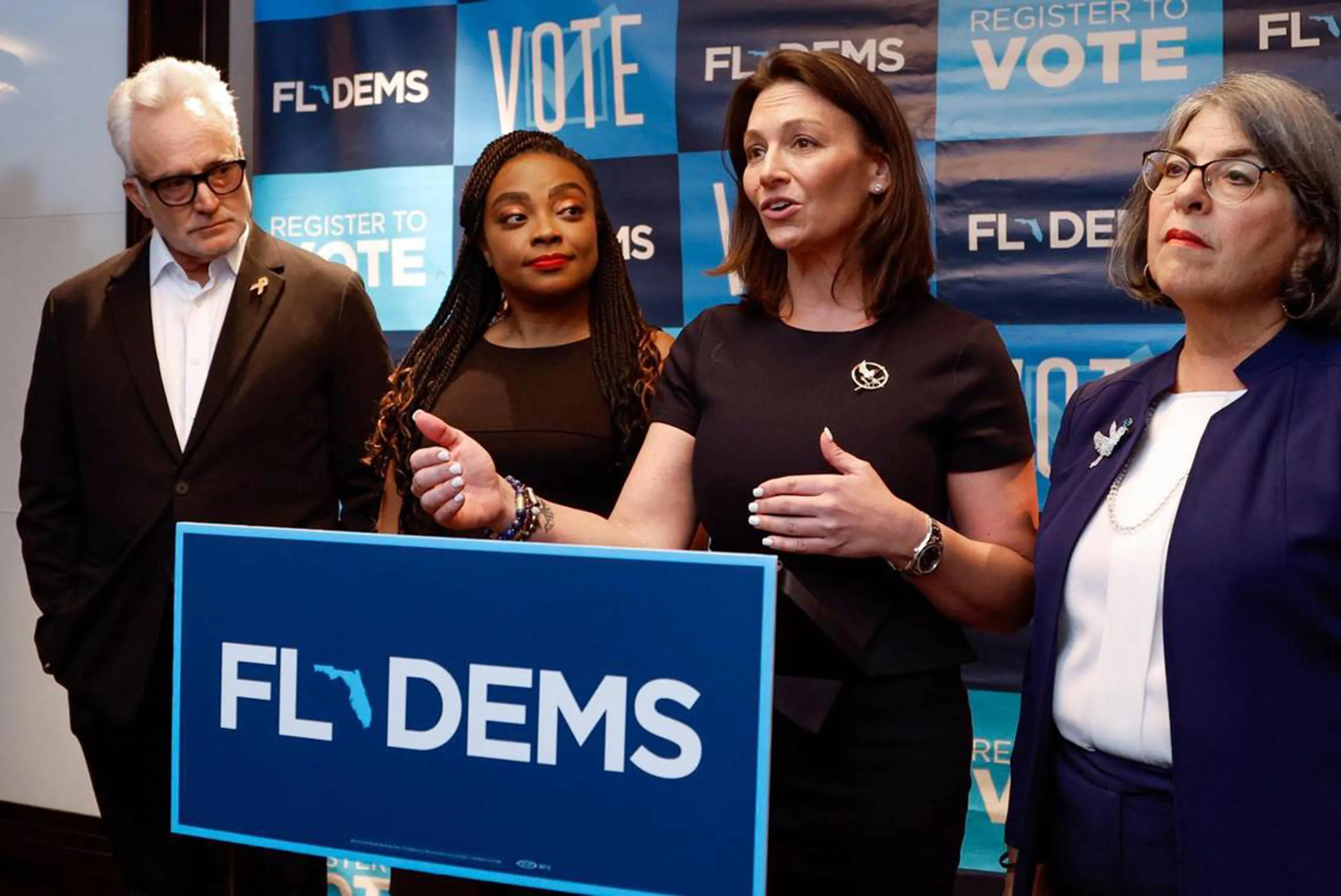 Florida Democratic Party Chair Nikki Fried, second from right, has a lot of work to do in fitting everyone into the tent.&nbsp;
